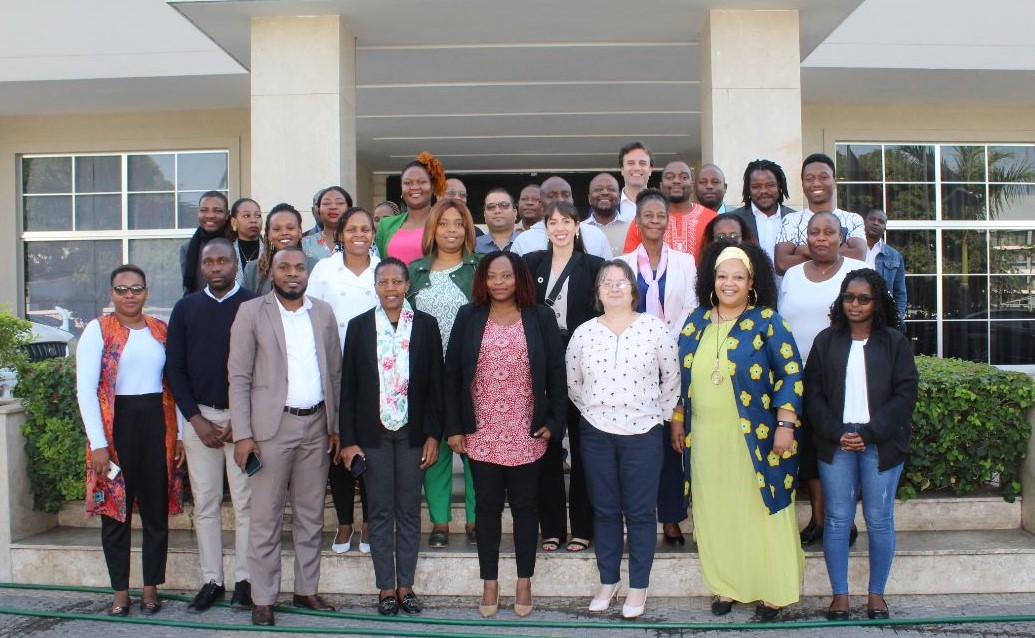 Workshop participants in Maputo, National Director for Climate Change at the Ministry of Land and Environment, Jadwiga Massinga in white shirt on the front row.